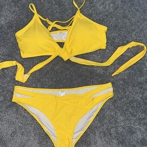 Bikini. Size med. open design on the sides in bottom. Top ties in the front.